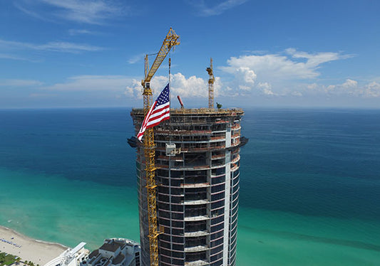 Dezer Development Announces Top-Off of Porsche Design Tower